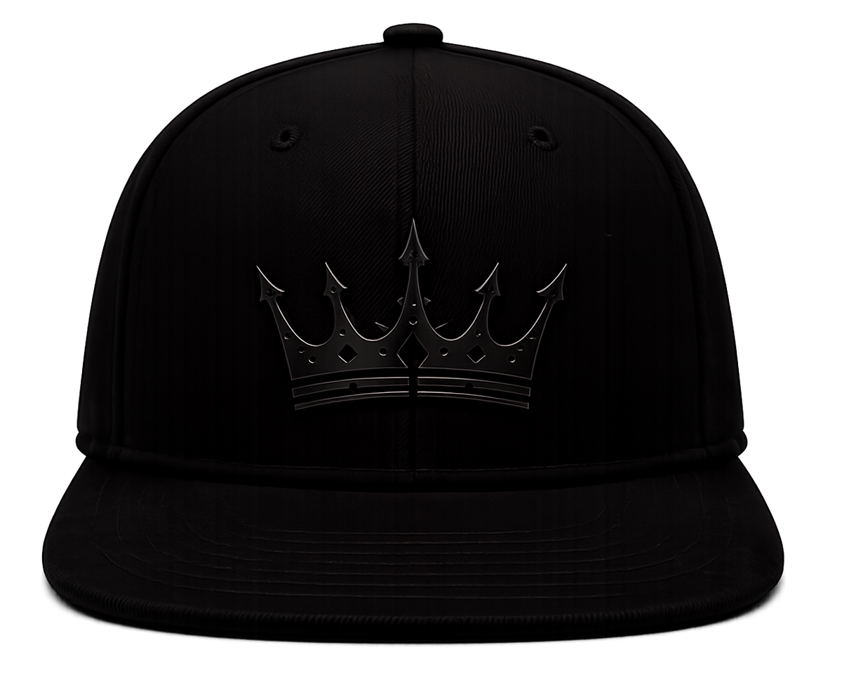 A black flat-brim baseball cap featuring a tonal black crown patch with a stylized crown emblem, shown against a plain white background.