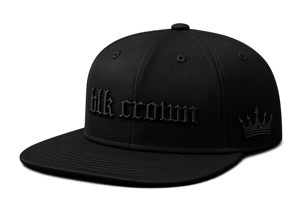 A black flat-brim snapback cap with 'blk crown' embroidered in gothic-style lettering on the front and a crown logo on the side, shown on a plain white background.